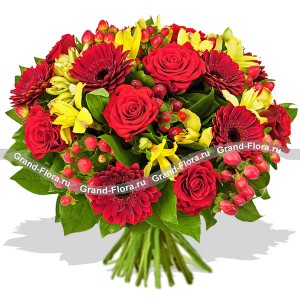 Bouquet in red and yellow colors of roses, chrysanthemums and hypericum