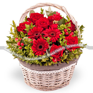 At dawn - a basket with red roses and gerberas